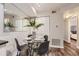 Bright dining area with glass table and four black chairs at 40 S Boulder Cir # 4014, Boulder, CO 80303