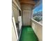 Private balcony with artificial turf flooring and storage at 5765 W Atlantic Pl # 103, Lakewood, CO 80227