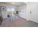 Cozy dining area with table and chairs near sliding glass door at 45024 Sunflower Ln, Bennett, CO 80102