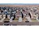 Large community of two-story homes with solar panels and various landscaping at 9299 Rifle St, Commerce City, CO 80022
