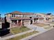 Two-story house on a quiet street with a two-car garage and front yard at 9299 Rifle St, Commerce City, CO 80022