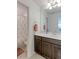 Bathroom with vanity, mirror, and shower/tub combo at 9299 Rifle St, Commerce City, CO 80022
