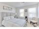 Bedroom with a queen bed and two windows at 9299 Rifle St, Commerce City, CO 80022