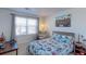 Bedroom with Marvel-themed bedding and a window seat at 9299 Rifle St, Commerce City, CO 80022