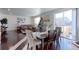 Bright dining room with hardwood floors and access to backyard deck at 9299 Rifle St, Commerce City, CO 80022