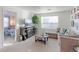 Cozy Gathering room with L-shaped sofa and a fireplace at 9299 Rifle St, Commerce City, CO 80022