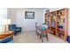 Home office features a desk, built-in shelves, and hardwood floors at 9299 Rifle St, Commerce City, CO 80022