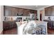 Modern kitchen with granite countertops and dark wood cabinetry at 9299 Rifle St, Commerce City, CO 80022