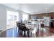 Kitchen with an island, stainless steel appliances, and hardwood floors at 9299 Rifle St, Commerce City, CO 80022
