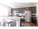 Spacious kitchen featuring granite countertops and stainless steel appliances at 9299 Rifle St, Commerce City, CO 80022