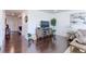 Spacious living room with hardwood floors and large windows at 9299 Rifle St, Commerce City, CO 80022