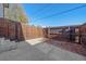 Small fenced backyard with patio and wood fence at 3744 Miller Ct, Wheat Ridge, CO 80033