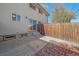 Small fenced backyard with patio and wood fence at 3744 Miller Ct, Wheat Ridge, CO 80033