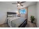 Guest bedroom with ceiling fan and striped bedding at 3744 Miller Ct, Wheat Ridge, CO 80033