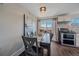 Dining area with kitchen access and sliding door to patio at 3744 Miller Ct, Wheat Ridge, CO 80033