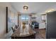 Bright dining area with a table for six and kitchen access at 3744 Miller Ct, Wheat Ridge, CO 80033