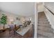 Living room with hardwood floors, staircase, and comfortable seating at 3744 Miller Ct, Wheat Ridge, CO 80033