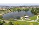 Aerial view of a pond in a park with a gazebo and walking paths at 20000 Mitchell Pl # 89, Denver, CO 80249