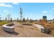 Community park with a stone seating wall and playground at 6251 N Malaya St, Aurora, CO 80019