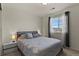 Bright bedroom with a queen bed and window coverings at 6251 N Malaya St, Aurora, CO 80019