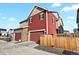 Two-story home with attached garage and wooden fence at 6251 N Malaya St, Aurora, CO 80019