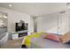 Main bedroom with a queen bed and electric fireplace at 6251 N Malaya St, Aurora, CO 80019