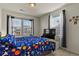 Bedroom with a double bed, TV, and window coverings at 6251 N Malaya St, Aurora, CO 80019