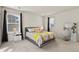 Spacious bedroom with a queen bed and vanity area at 6251 N Malaya St, Aurora, CO 80019