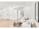 Cozy sitting area with white armchairs and a wood accent table at 4930 E Ellsworth Ave, Denver, CO 80246