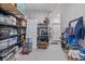 Garage storage area with shelves, storage containers, and organizational tools at 16841 Askins Loop # 101, Parker, CO 80134