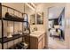 Bathroom with vanity, shelving, and view to living area at 3438 Cade Ct, Castle Rock, CO 80104