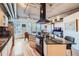 Modern kitchen with large island, stainless steel appliances, and exposed ductwork at 1499 Blake St # 5I, Denver, CO 80202