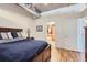 Bright bedroom with ensuite bathroom access and hardwood floors at 1499 Blake St # 5I, Denver, CO 80202