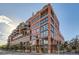 Brick building exterior, multiple stories, with balconies and street-level access at 1499 Blake St # 5I, Denver, CO 80202