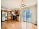 Modern kitchen with stainless steel appliances and light wood cabinets at 6897 Newcombe St, Arvada, CO 80004