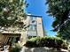 Building exterior with landscaping and a patio at 16001 E Alaska Pl # 7, Aurora, CO 80017