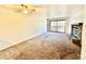 Living room features a fireplace and sliding glass doors to a balcony at 16001 E Alaska Pl # 7, Aurora, CO 80017