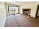 Living room boasts a fireplace and access to a private balcony at 16001 E Alaska Pl # 7, Aurora, CO 80017