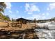 Rustic barn with open sides and fenced area at 5274 S Hatch Dr, Evergreen, CO 80439