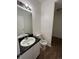 Clean bathroom with dark vanity and flooring at 2217 S Telluride Ct, Aurora, CO 80013