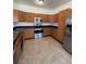Bright kitchen featuring stainless steel appliances and wood cabinets at 2217 S Telluride Ct, Aurora, CO 80013