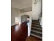 Bright living room with hardwood floors and access to the stairs at 2217 S Telluride Ct, Aurora, CO 80013