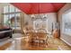 Bright dining room featuring hardwood floors and a charming chandelier at 10834 Bobcat Ter, Lone Tree, CO 80124