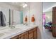 Double vanity bathroom with view into bedroom at 10834 Bobcat Ter, Lone Tree, CO 80124