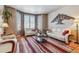 Spacious living room with bay window and comfy seating at 10834 Bobcat Ter, Lone Tree, CO 80124