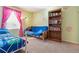 Bedroom with futon, bookcase, and window at 10834 Bobcat Ter, Lone Tree, CO 80124