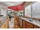 View of kitchen with granite countertops and wood cabinets at 10834 Bobcat Ter, Lone Tree, CO 80124