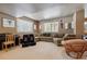 Relaxing basement Gathering room with sectional sofa, piano, and ample natural light at 10834 Bobcat Ter, Lone Tree, CO 80124