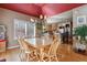 Bright breakfast nook with hardwood floors and a view into the kitchen at 10834 Bobcat Ter, Lone Tree, CO 80124