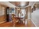 Formal dining room with hardwood floors, a large table, and a built-in hutch at 10834 Bobcat Ter, Lone Tree, CO 80124